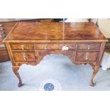 WRITING DESK, 19th century walnut, feather banded top, on carved cabriole legs,