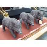 WILD BOARS, a stylised set of three, 31cm H.