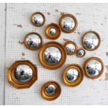 CONVEX WALL MIRRORS, a collection of twelve, of various sizes and description, largest 26cm Diam.