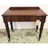 WRITING TABLE, Victorian mahogany with two frieze drawers on turned supports and ceramic castors,