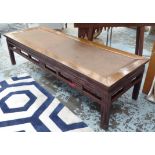 OPIUM TABLE, early 20th century Oriental inspired, padauk wood and rattan, 197cm x 67cm x 51cm.