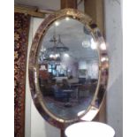 VENETIAN LOOKING GLASS, Art Deco style, oval with gilt metal bordered marginal plates, 103cm x 71cm.