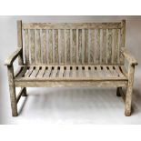 GARDEN BENCH, silvery weathered teak of slatted form by 'Westminster', 122cm W.