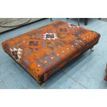 FOOTSTOOL, upholstered in a kilim fabric, 109cm W x 80cm D x 34cm H.