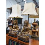 BUDDHA TABLE LAMPS, a duo with differing shades, 95cm at tallest.