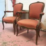 FAUTEUILS, a pair, French Louis XV design, carved walnut show frames and patterned red upholstery,