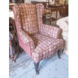 WING BACK CHAIR, in a red patterned fabric with contrasting back on square tapering supports,