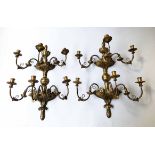 CANDELABRA WALL LIGHTS, a pair, Italian carved giltwood each with two foliate tiers,