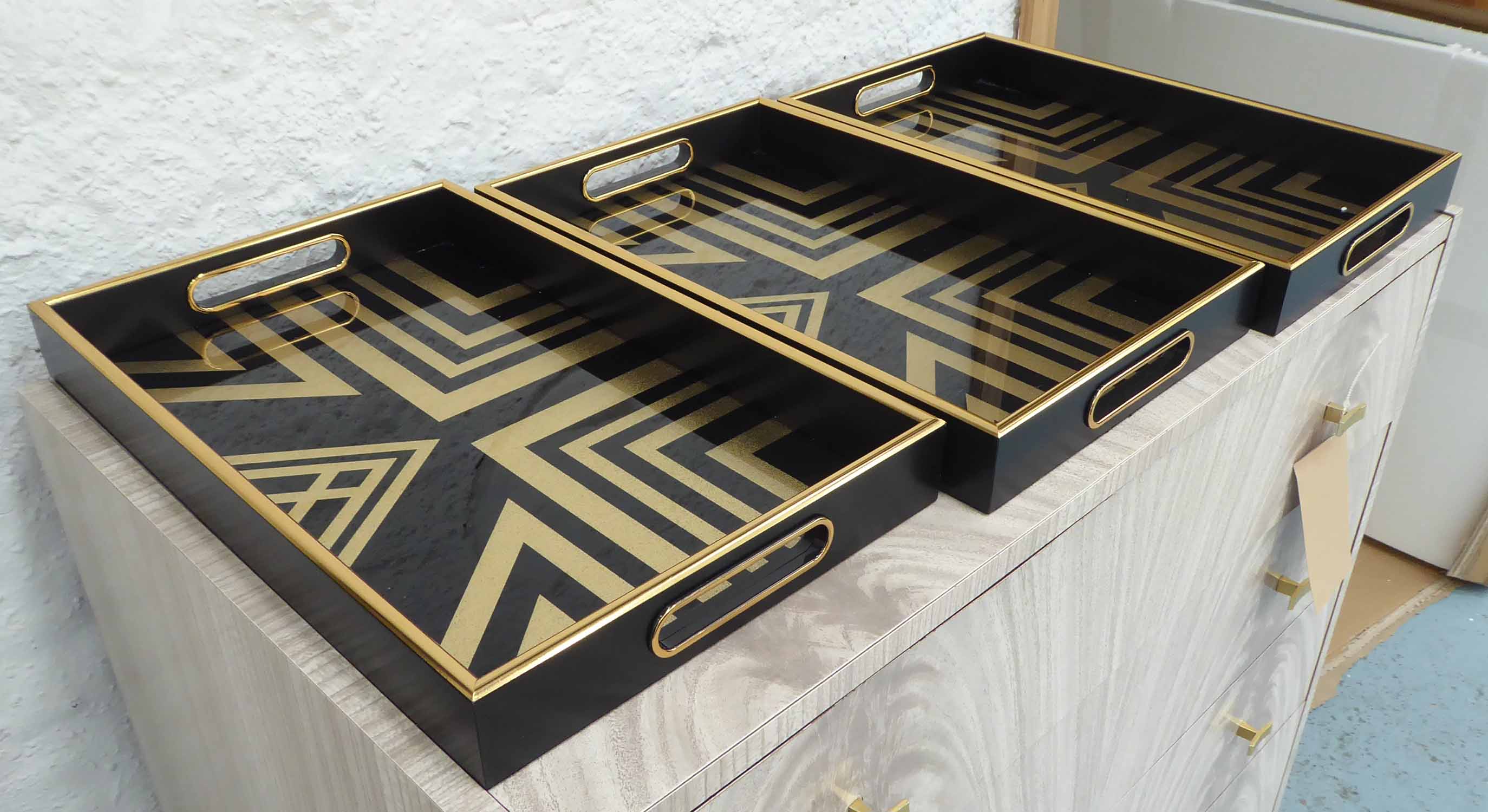 DRINKS TRAYS, a set of three, French Art Deco style, 41cm x 26cm x 5cm.