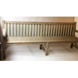 COUNTRY ESTATE BENCH, silvery weathered teak of slatted construction and exceptional length,
