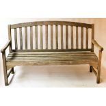 ARCHED GARDEN BENCH, silvery weathered teak of slatted construction with arched back, 152cm W.