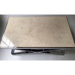 EICHOLTZ STYLE LOW TABLE, rectangular travertine marble raised on X frame chrome supports,