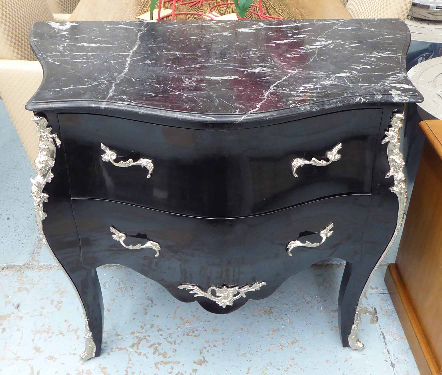 BOMBE COMMODE, Louis XV inspired, ebonised with polished metal mounts two drawers and marble top,