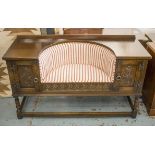 HALL CHEST, 20th century carved oak with newly re upholstered striped seat and two doors,