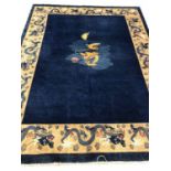 ANTIQUE TIBETAN TEMPLE DRAGON CARPET, 350cm x 250cm.