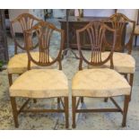 DINING CHAIRS, a set of four, George III mahogany, circa 1780, shield back,