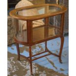 DRINKS CABINET, early 20th century mahogany oval with two handles, curved glass to ends,