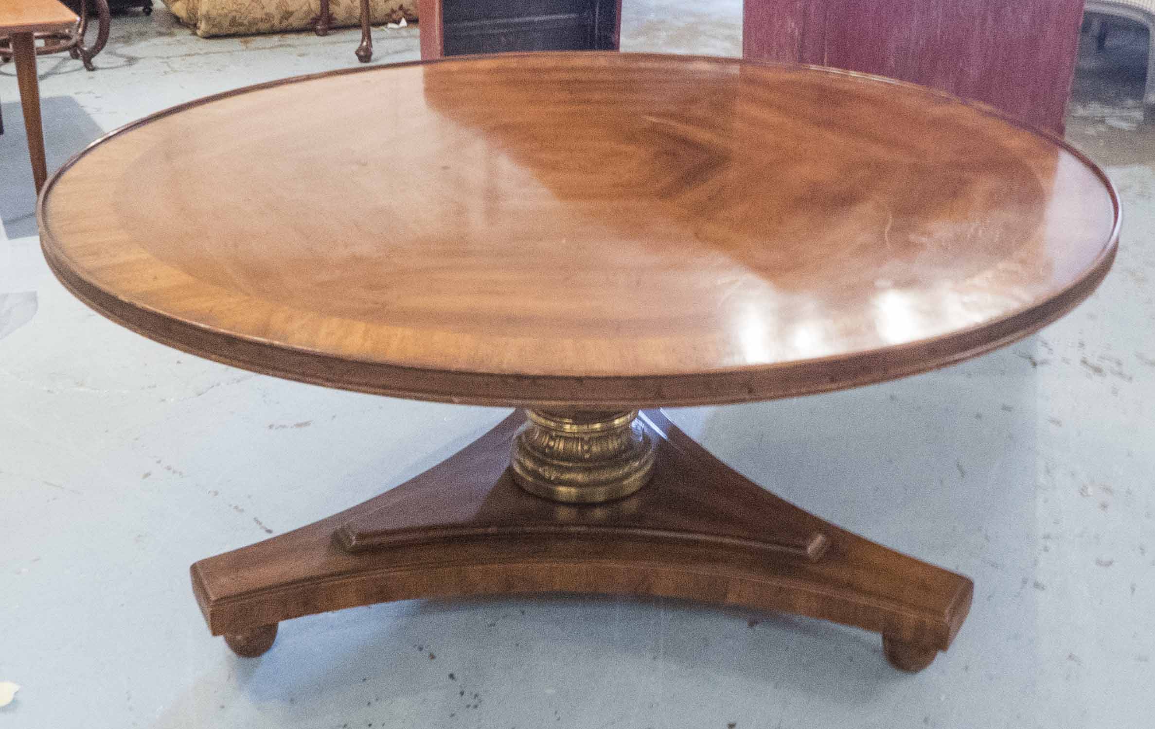 LOW TABLE, circular, Regency influenced cherrywood on a triform base, 45cm H x 96cm D.