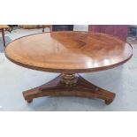 LOW TABLE, circular, Regency influenced cherrywood on a triform base, 45cm H x 96cm D.