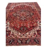 ANTIQUE PERSIAN HERIZ CARPET, 395cm x 293cm, Serapi design.