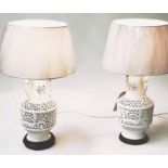 LAMPS, a pair, reticulated white ceramic of vase form with shades, 76cm H.