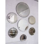 ENGLISH BULLSEYE BEVELED MIRRORS, a collection of seven, early 20th century (one later),