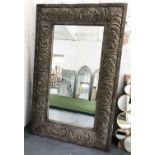 WALL MIRROR, of large proportions, with a composite carved wood style frame, 193cm H x 122cm.