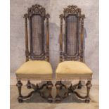 HALL CHAIRS, a pair, early 20th century William and Mary style walnut with carved crests,