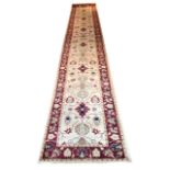 FINE SULTANABAD RUNNER, 536cm x 77cm, all over palmette and vine design on an ivory field.