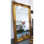 WALL MIRROR, of large proportion, Continental style gilt, 208cm x 114cm.