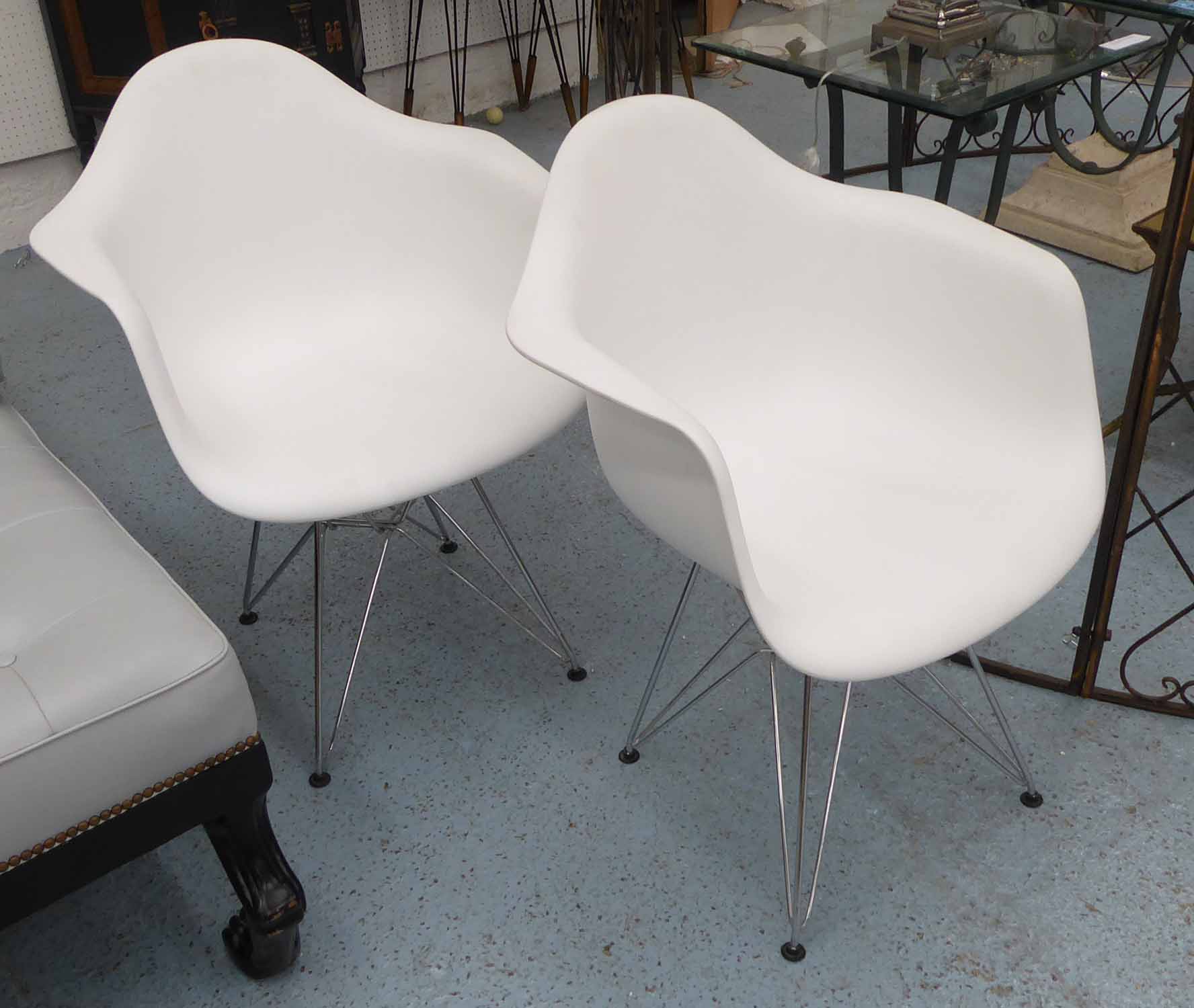 AFTER CHARLES AND RAY EAMES DAR STYLE ARMCHAIRS, a pair, 80cm H.