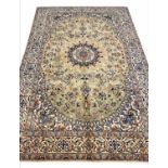 FINE PERSIAN PART SILK NAIN CARPET, 298cm x 194cm, central medallion on a palmette and vine field,