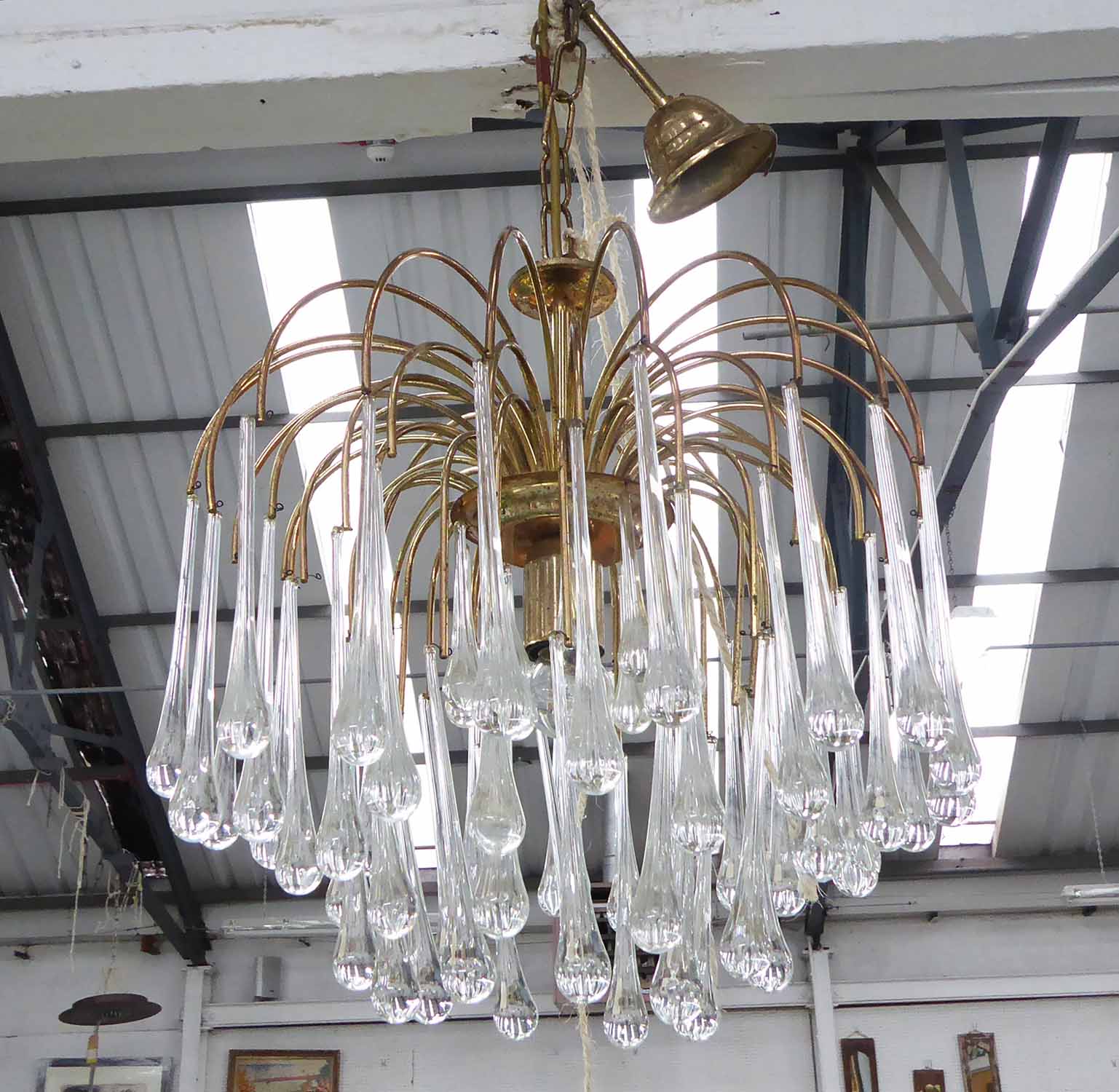 CHANDELIER, circa 1970s, the brass frame with glass droplets, approx. 36cm W x 94cm H.