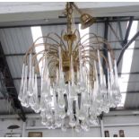 CHANDELIER, circa 1970s, the brass frame with glass droplets, approx. 36cm W x 94cm H.