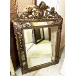 WALL MIRROR, late 19th century, Continental gilt painted with cushioned carved wood frame,