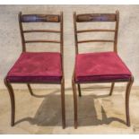 SIDE CHAIRS, a pair, Regency fine mahogany with buttoned squab cushions and caned seats.