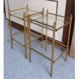 SIDE TABLES, a pair, glass and brass, with undertier and reeded supports, 38cm W x 38cm D x 72cm H.