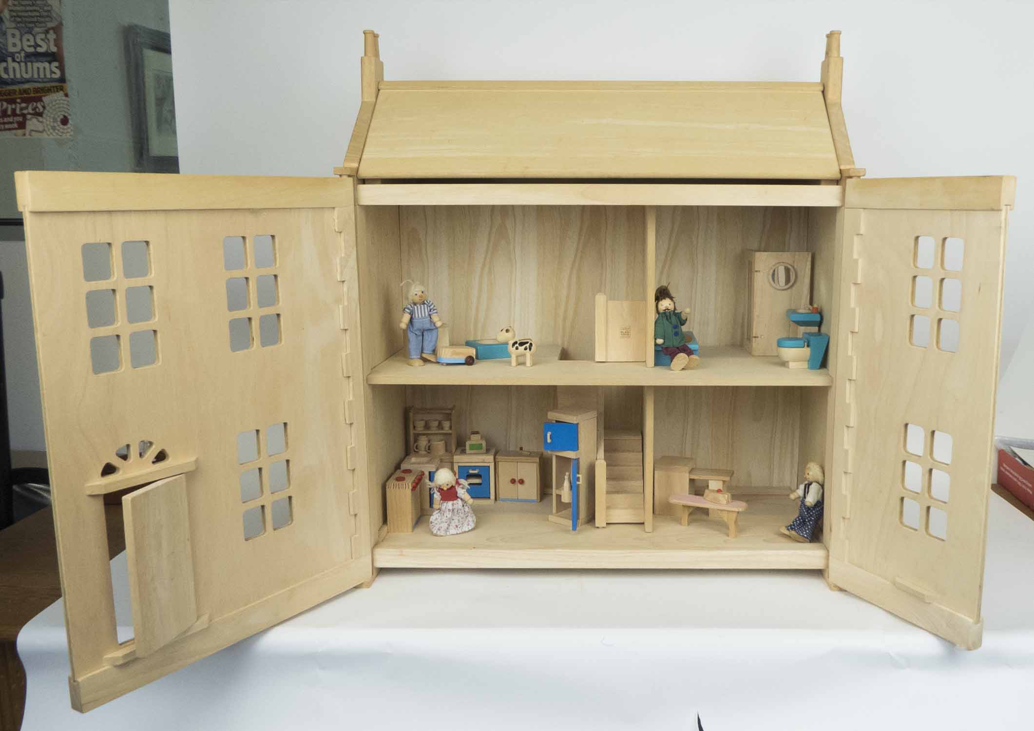 DOLL'S HOUSE WITH FURNITURE AND DOLLS, contemporary (with faults, sold as seen) 63.5cm x 32.