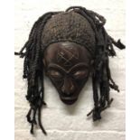 AFRICAN 'KUBA' TRIBE MASK, carved wood adorned with cord hair, 30cm .