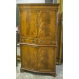 SERPENTINE COCKTAIL CABINET, Georgian style, mahogany, with four doors,