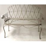 GARDEN SEAT, Provincial style, painted wrought iron, with scroll back and swag frieze, 120cm W.