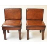 COCKTAIL CHAIRS, a pair, Art Deco style, antique mid brown leather upholstered (with faults).