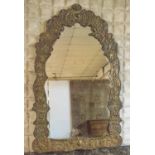 WALL MIRROR, 19th century Continental brass with arched repousse decorated frame, 103cm H x 64cm W.