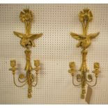 WALL SCONCES, a pair, gilt, with eagle detail, each 75cm H x 25cm W.