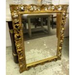 WALL MIRROR, 18th century style Florentine gilt framed with scrolling foliage, 105cm x 82cm.