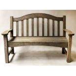 ARCHED GARDEN BENCH, silvery weathered teak, slatted and arched back and flat arms,