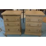 BEDSIDE CHESTS, a pair, each with three drawers and brushing slide in a grey painted finish,