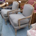 FAUTEUILS, a pair, French provincal style, in grey fabric with carved showframes, 62cm W x 69cm H.