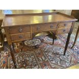 WRITING TABLE, George IV mahogany, with three quarter galleried top above five drawers,
