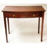 BOWFRONT WRITING TABLE, George III figured mahogany and ebony lined with full width frieze drawer,